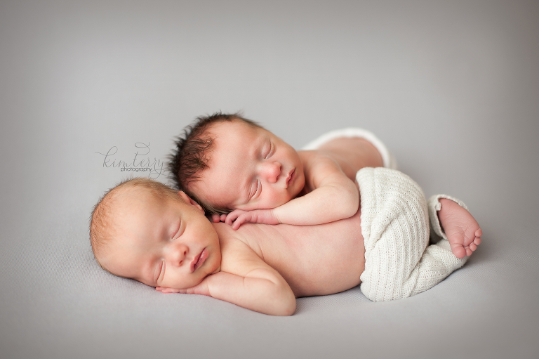 newborn twin boys posed