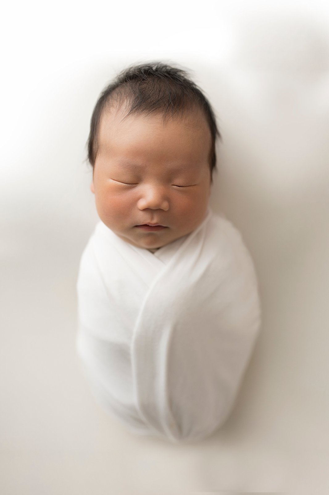 Suwanee newborn wrapped baby