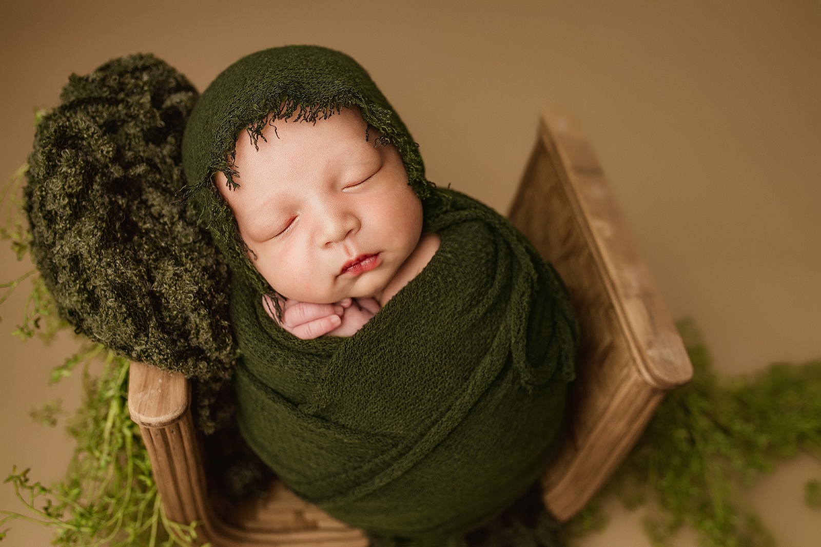 newborn wrapped in a prop